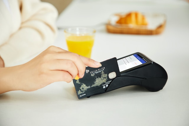 Person swiping credit card