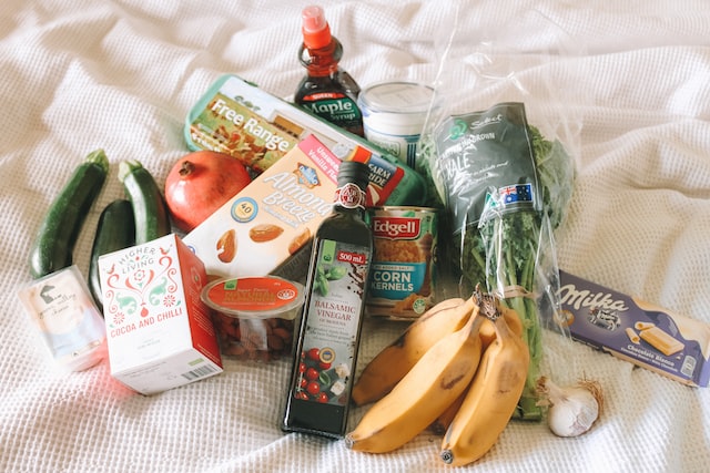 Groceries on bed.